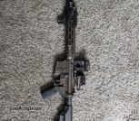 LWRC DI AR 15 with Unity riser and Sig red dot and magnifier 